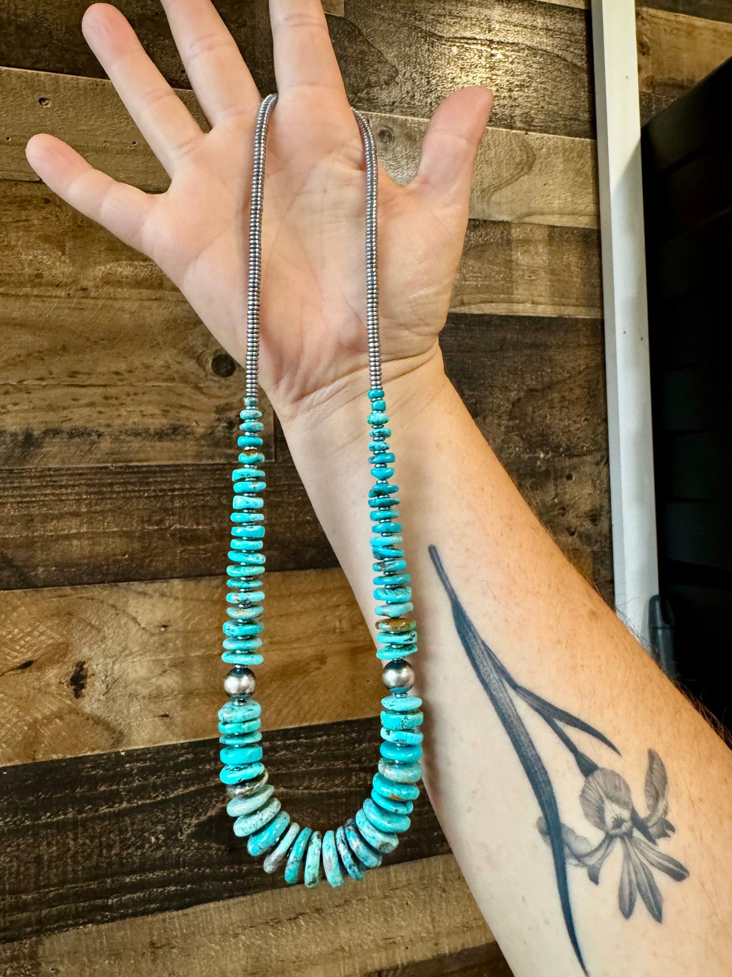 22 inch graduated turquoise necklace with Sterling silver pearls